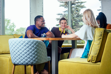 multinational group of happy friends enjoy and drinking tea cafe .