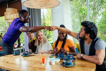 international people drinking tea(coffee) in cafe