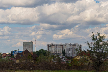 Fototapeta na wymiar Outskirts of Chisinau. Panorama with the capital of Moldova. Cloudy sky before the rain.
