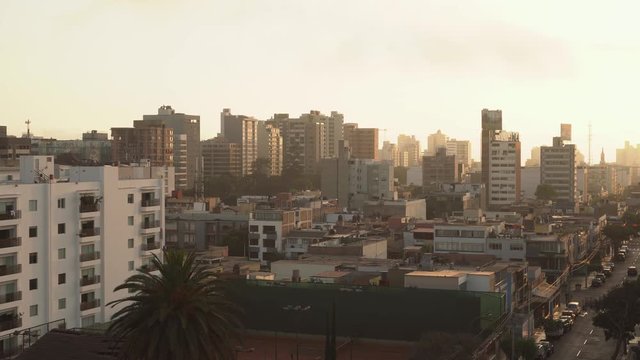Sunset over the skyline of Lima city with modern architecture, Peru