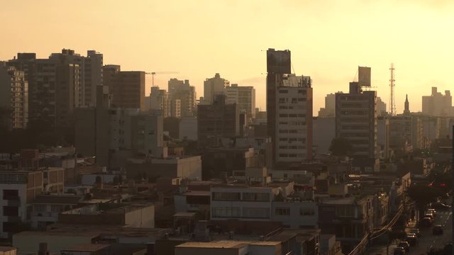 Lovely view of cityscape of Lima during beautiful orange sunset, Peru