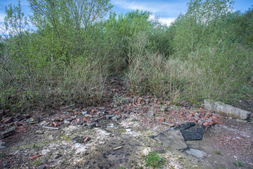 Site of former gas works, now derelict and overgrown after many years of disuse.