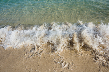 wave on sandy beach background
