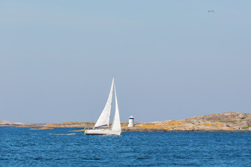 Fototapeta premium Sailboat in rocky archipelago
