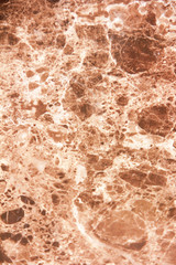 marble brown decorative wall with patterns, stains and cracks