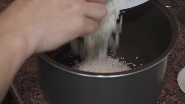 Rice for pilaf poured into the pan and mix