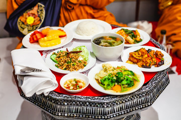Group of Food Slice Grilled Pork, Deep Fried Fillet Fish, Stir Broccoli, Minced Pork Spicy. Foods from Newlyweds Offering to the Buddhist Monk in Thai Traditional Wedding Ceremony.