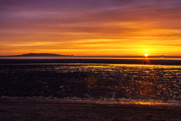 sunrise on coast line with horizon