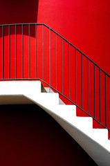 architecture details white steps and railings with a red wall