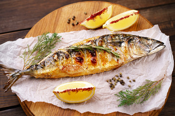 grill pub and fish restaurant menu, proper nutrition, seafood, vegetarian, pescetarian. grilled mackerel fish with lemon and herbs