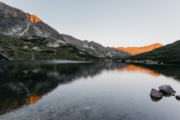 Lake in Polish Tatra mountains in sunrise