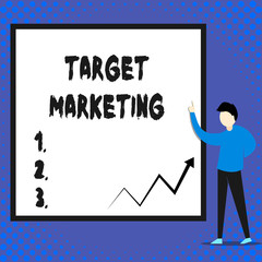 Writing note showing Target Marketing. Business photo showcasing Audience goal Chosen clients customers Advertising Man standing pointing up blank rectangle Geometric background.