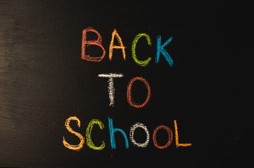  Back to school, the concept of parenting. The inscription on the blackboard colored chalk.