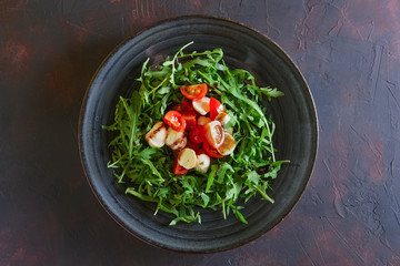 Salad with mozzarella, tomato and arugula