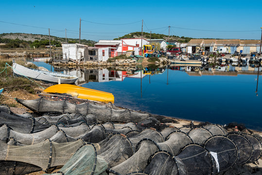 Fishing tackles and boats of fishers village in the border of Ayroll Laguna, Narbone region of French Occitanie.