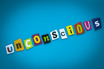 A single word - Unconscious - from cut colorful letters on a blue background. Text on banner. Inscription on card. Psychologic concept. Caption, heading, multicolored headline. Message on poster.