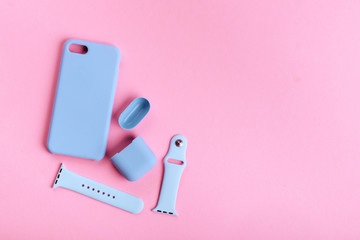 Up to date technology.Top view of diverse personal accessory laying on the pink background