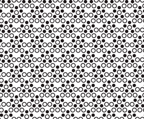 Seamless pattern with black dots and rings on white background. EPS10 vector illustration.