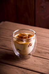 Modern summer refreshing drink with iced coffee cubes