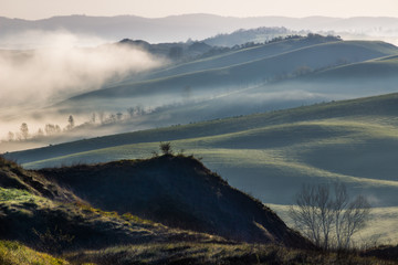 sunrise and fog in Tuscany