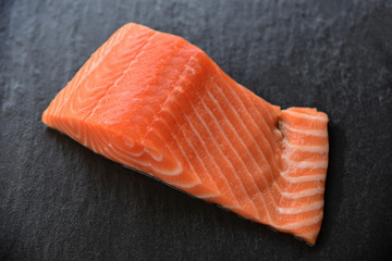 Fresh salmon fillet fish seafood on dark