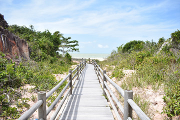 Fototapeta na wymiar wooden bridge going to the beach