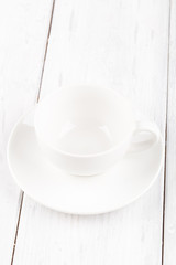Empty cup of coffee or tea on wooden background