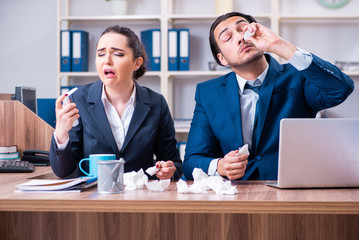 Two employees suffering at workplace 