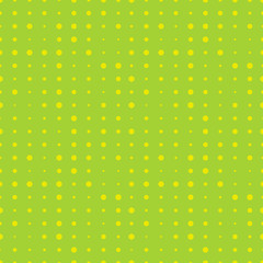 Halftone seamless pattern with yellow circles on green. Dotted texture. Polka dot background. Abstract round seamless pattern. Vector illustration.