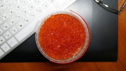 Red caviar in plastic can . Sea food. Healthy eating.