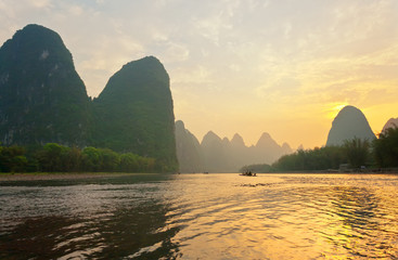 Unusual natural landscape with green karst hills and the Li River (Lijiang River). The place that is depicted on the bill is 20 yuan. Beautiful Chinese nature park. Travels in China - obrazy, fototapety, plakaty