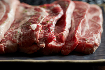 Sliced steak meat with dried parsley 