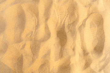Fototapeta na wymiar Closeup of sand pattern of a beach in the summer