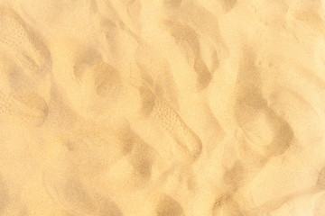 Fototapeta na wymiar Closeup of sand pattern of a beach in the summer