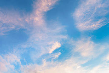 Cirrus clouds on blue sky background.