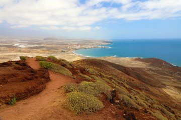Fototapeta na wymiar Fantastic views of El Medano from the Montana Roja (Red Mountain), Tenerife, Spain, Europe. Artistic picture. Beauty world.