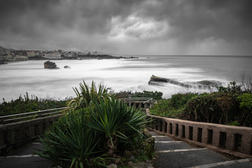 beautiful view on atlantic coast in Biarritz in long exposure in stormy weather, basque country