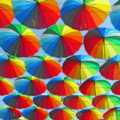 many colored umbrellas in the sky. Multicolored background. Umbrella. Weather       