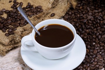 Coffee cups and coffee beans on top