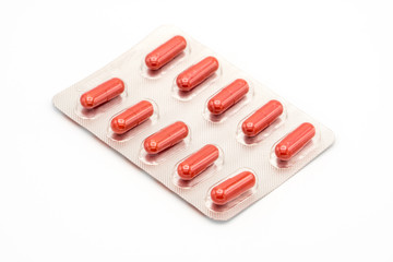 Supplements and pills blister packs, close-up. Place to insert your text, white background. Concept pharmaceutical industry and global healthcare
