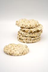 Grain crispbreads on white background. Puffed whole grain crispbread. Dieting Eating Concept. Copy space