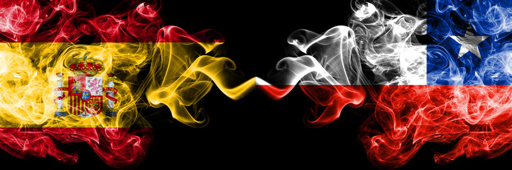 Spain vs Chile, Chilean smoky mystic flags placed side by side. Thick colored silky smokes flag of Spanish and Chile, Chilean