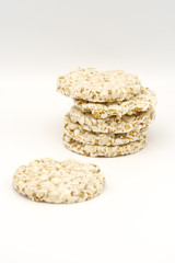 Grain crispbreads on white background. Puffed whole grain crispbread. Dieting Eating Concept. Copy space