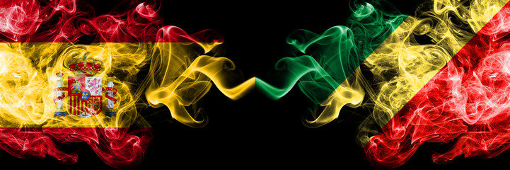 Spain vs Congo, Congolese smoky mystic flags placed side by side. Thick colored silky smokes flag of Spanish and Congo, Congolese