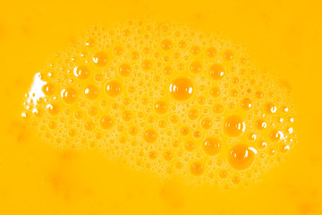 Whipped yolk with eggs as an abstract background