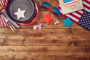 Happy Independence Day, 4th of July celebration concept with USA flag and barbeque grill  on wooden background.