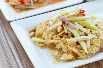 spicy salad with crispy fried catfish