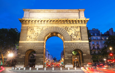 Fototapeta na wymiar Paris, the porte Saint-Martin, beautiful ancient gate near the Grands Boulevards.