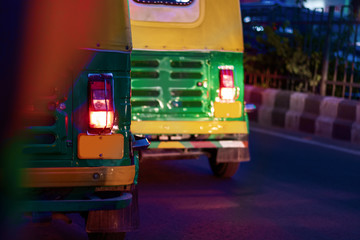 rear view of auto rickshaw, also known as tuk tuk - a popular means of transportation in New Delhi, India and in other Asian countries like Thailand
