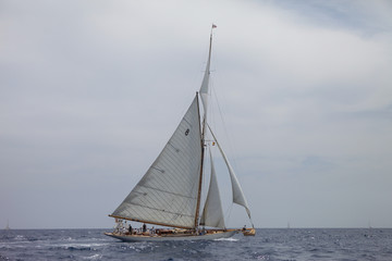 Nautical sports in the ocean. Vintage yachts race in Barcelona. Old ships and boats in the sea....